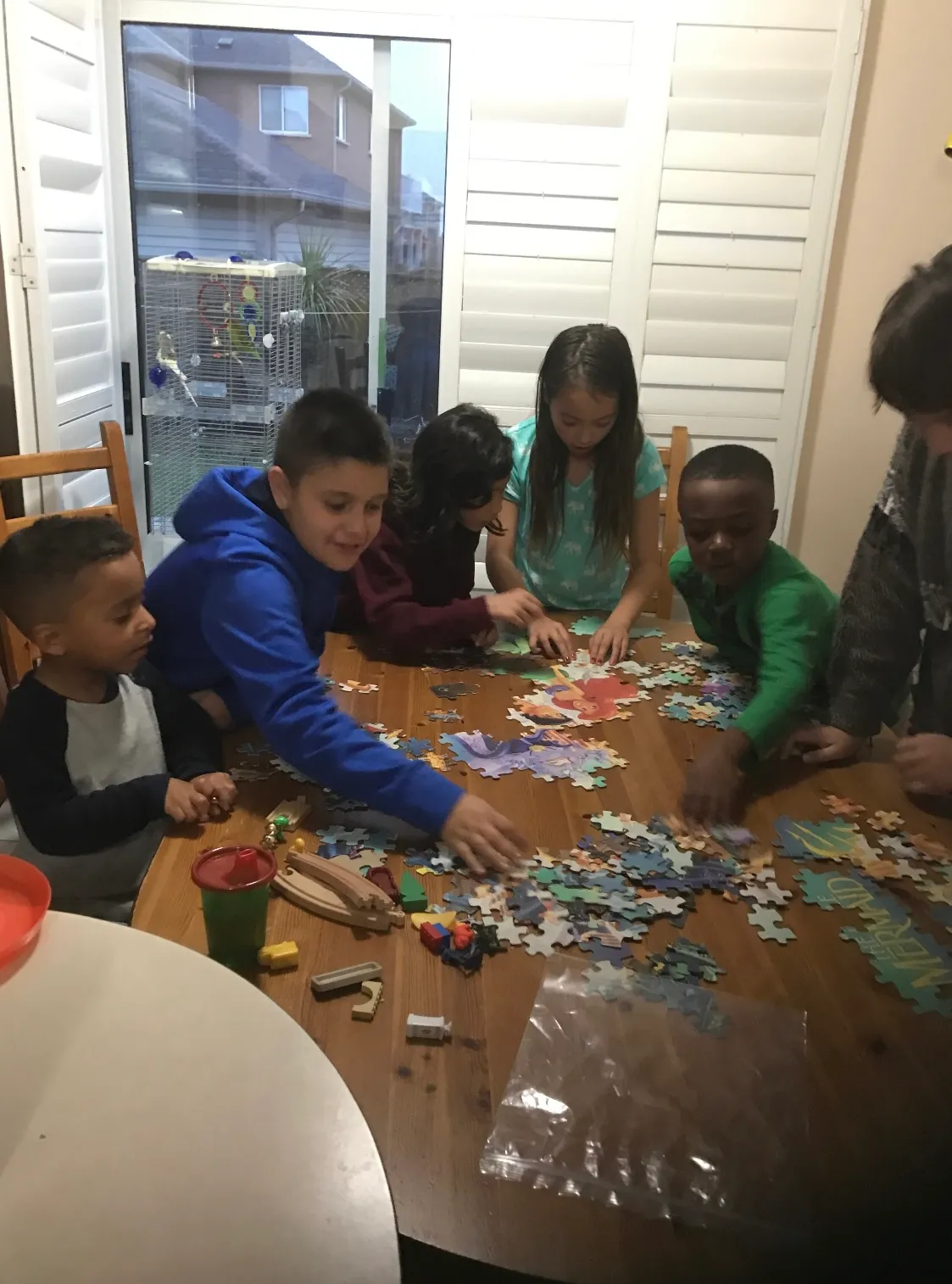 Photo of daycare kids solving puzzles